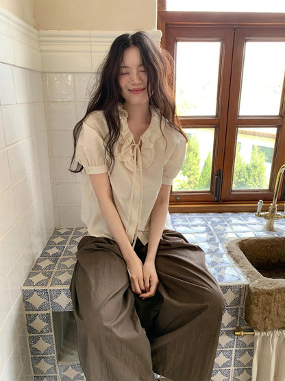 V-Neck Short Sleeve Shirt with Lace-Up Detail and Raglan Sleeves