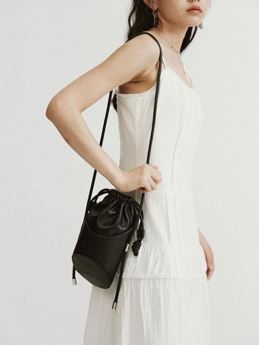 FUSSED Asymmetrical Geometric Drawstring Pu Crossbody Bag Black