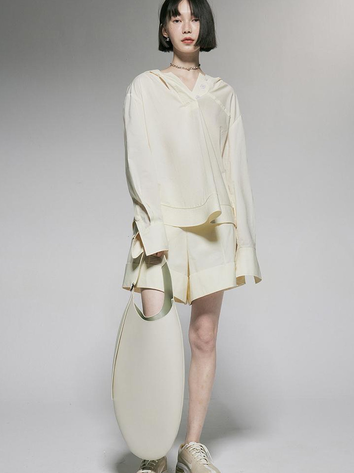 FUSSED Ivory Cotton Wide Leg Shorts With Pleats And Cuffed Hem