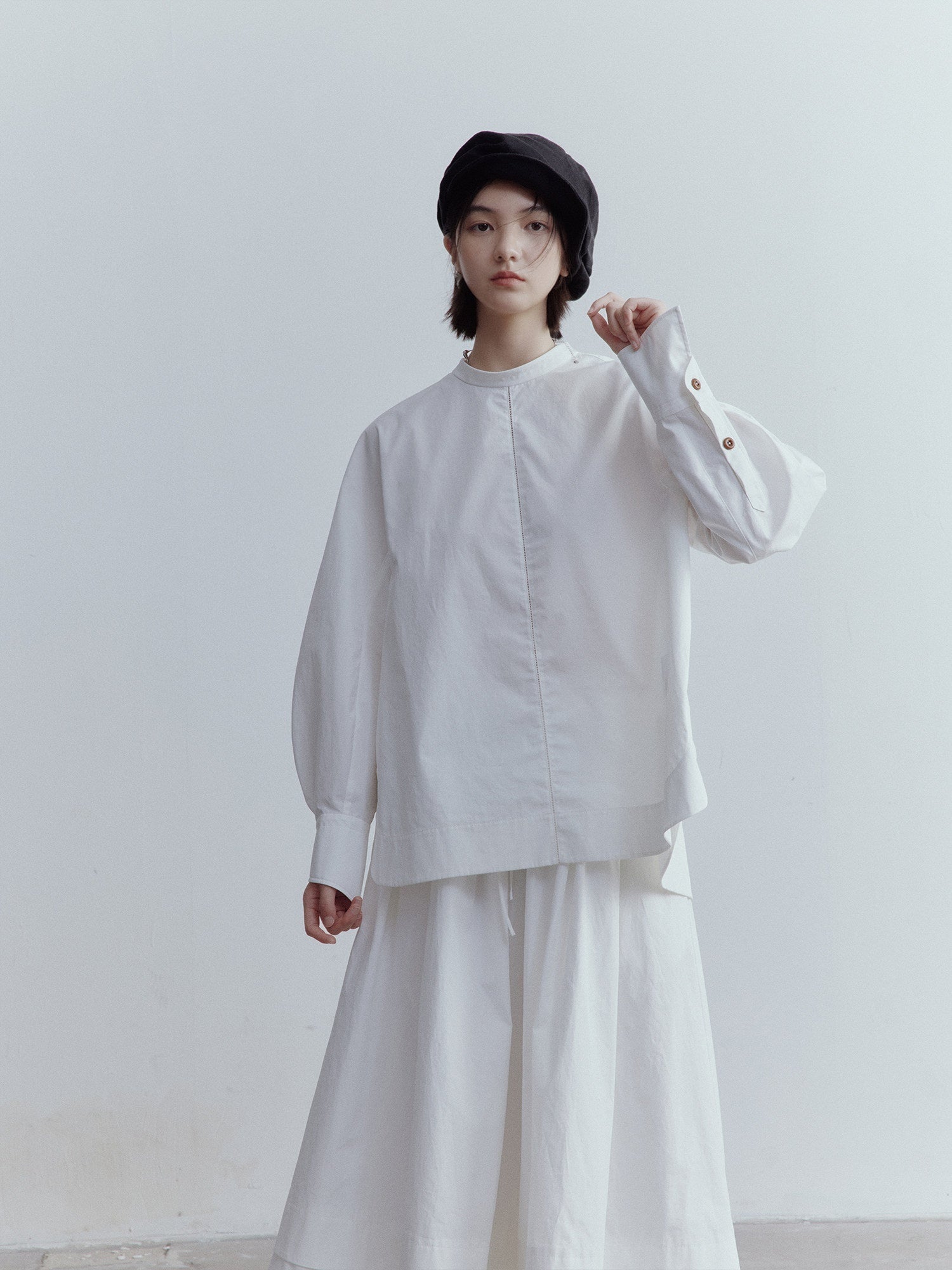 FUSSED Mist White Oversized Asymmetric Sleeve Cutout Splice Women&