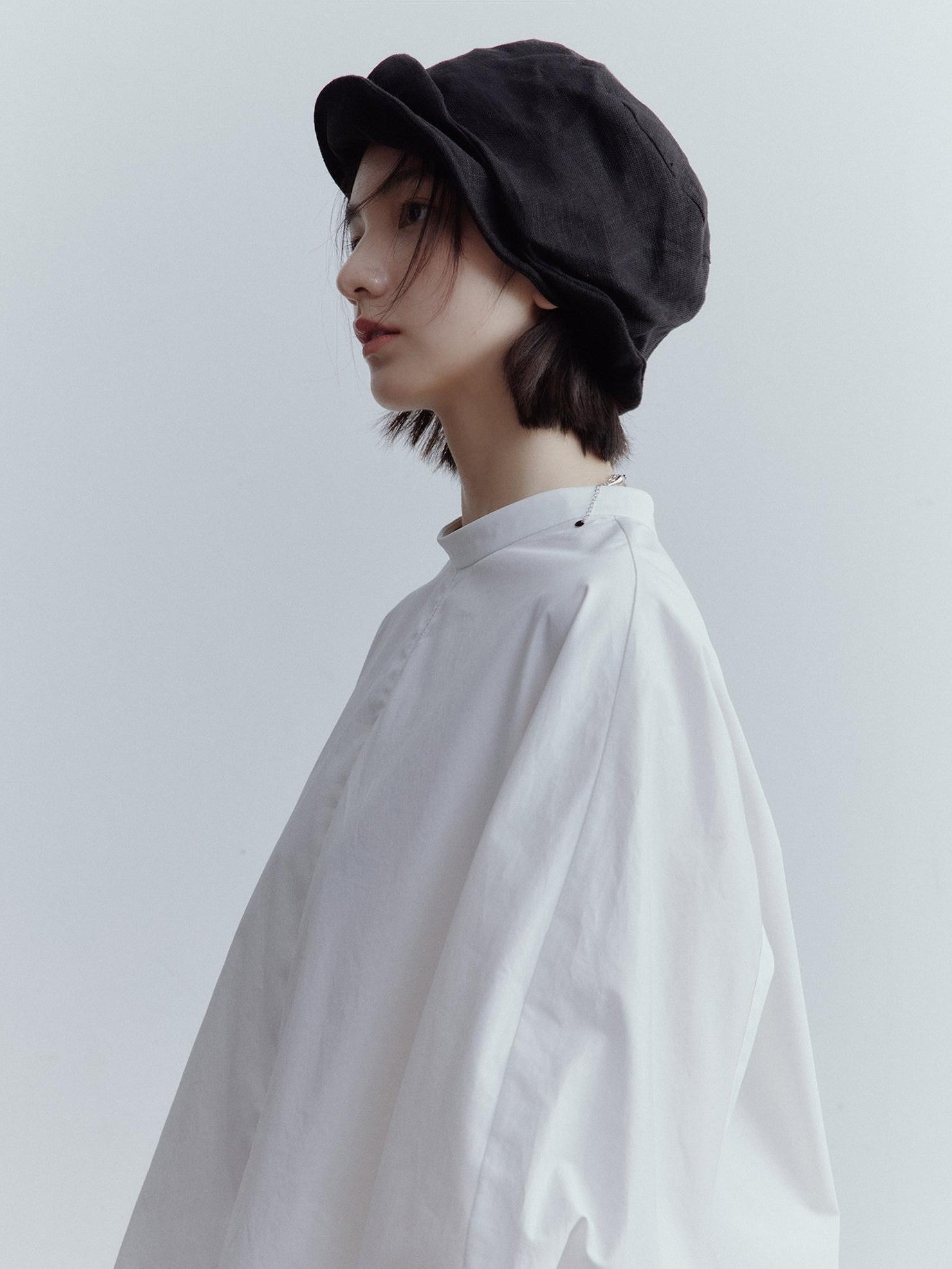FUSSED Mist White Oversized Asymmetric Sleeve Cutout Splice Women&