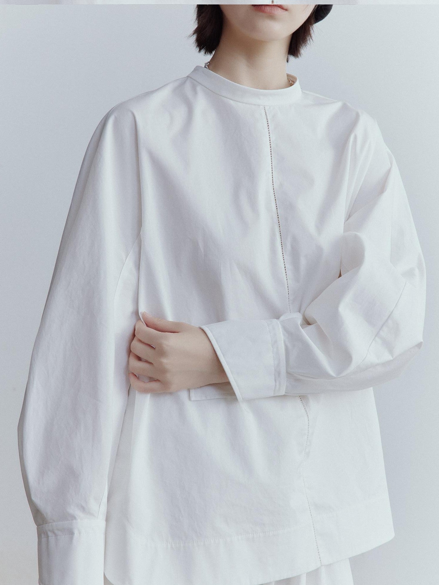 FUSSED Mist White Oversized Asymmetric Sleeve Cutout Splice Women&