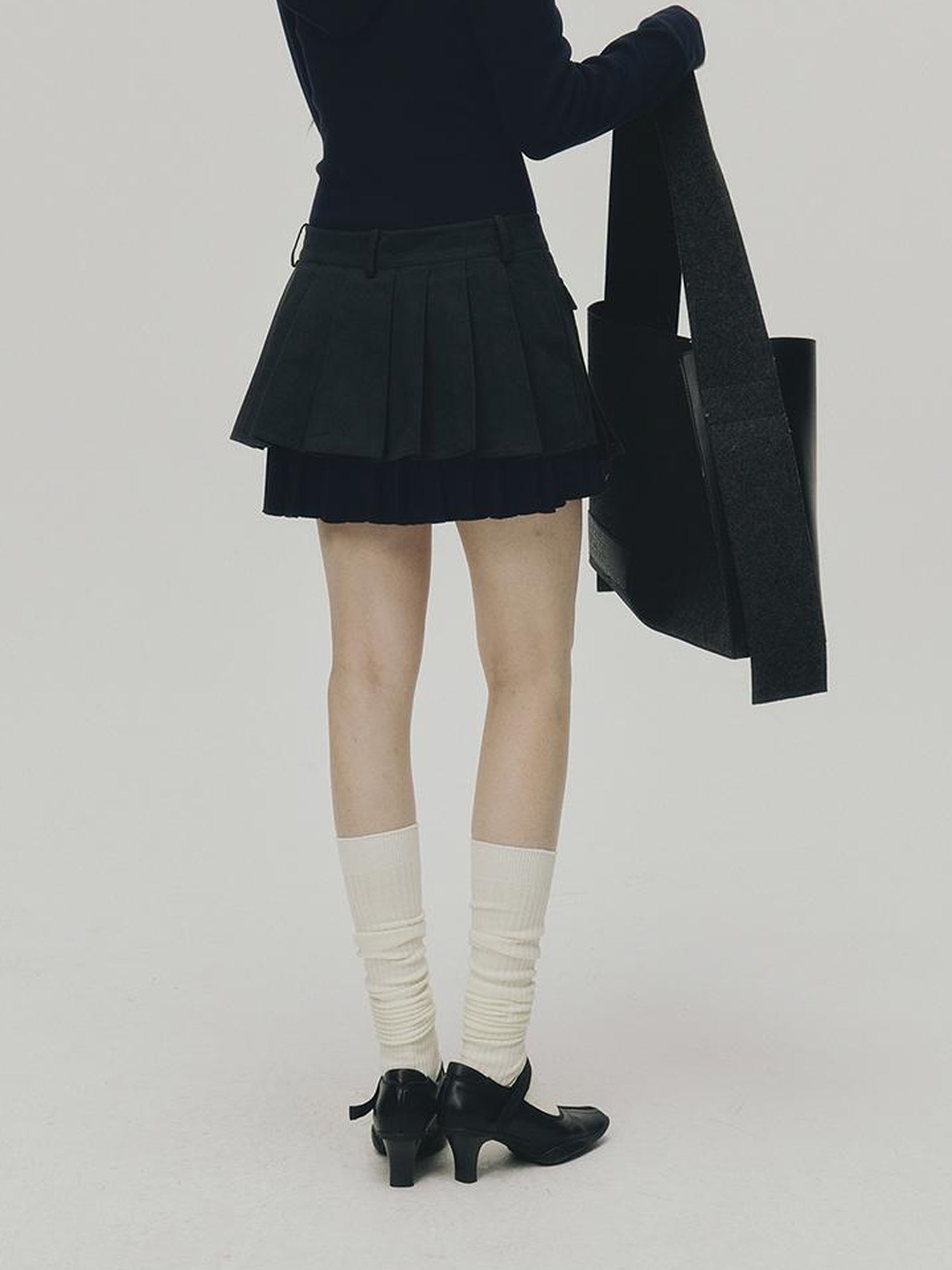 FUSSED Structured Pleated Mini Skirt With Asymmetric Pocket In Dusk Blue