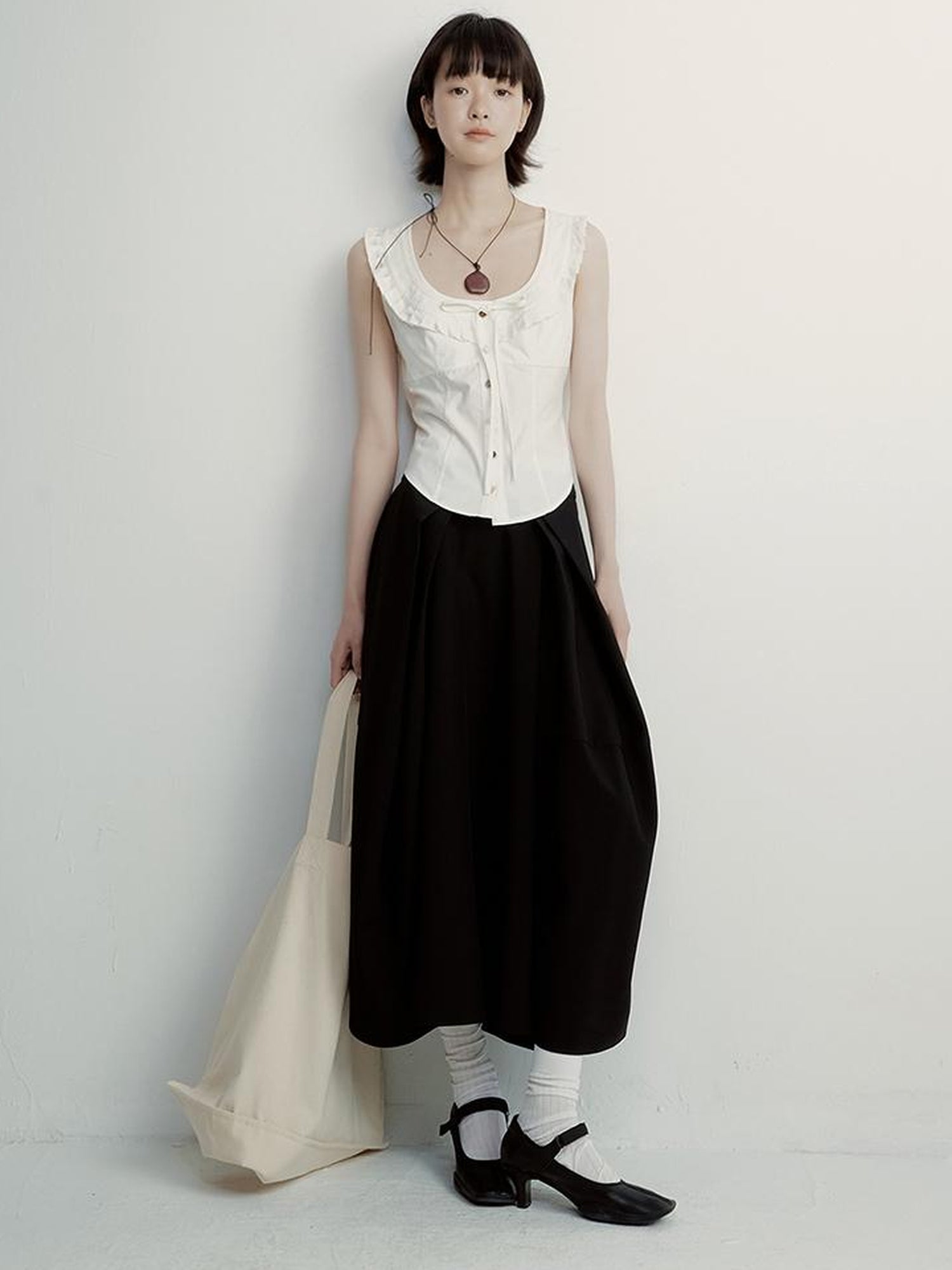 FUSSED Tencel Black Cocoon Midi Skirt With Pleats Draping