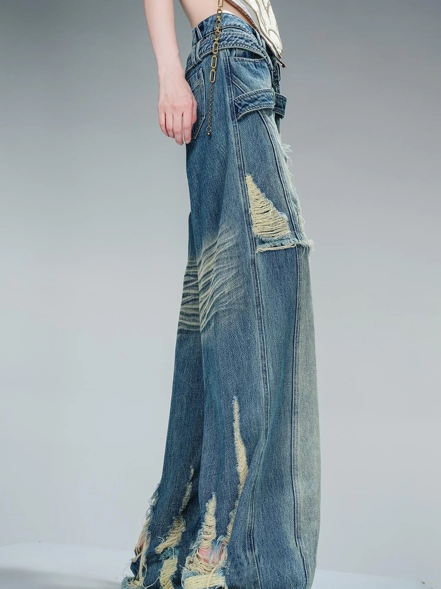 Distressed Pulled Denim Jeans With Ripped Details