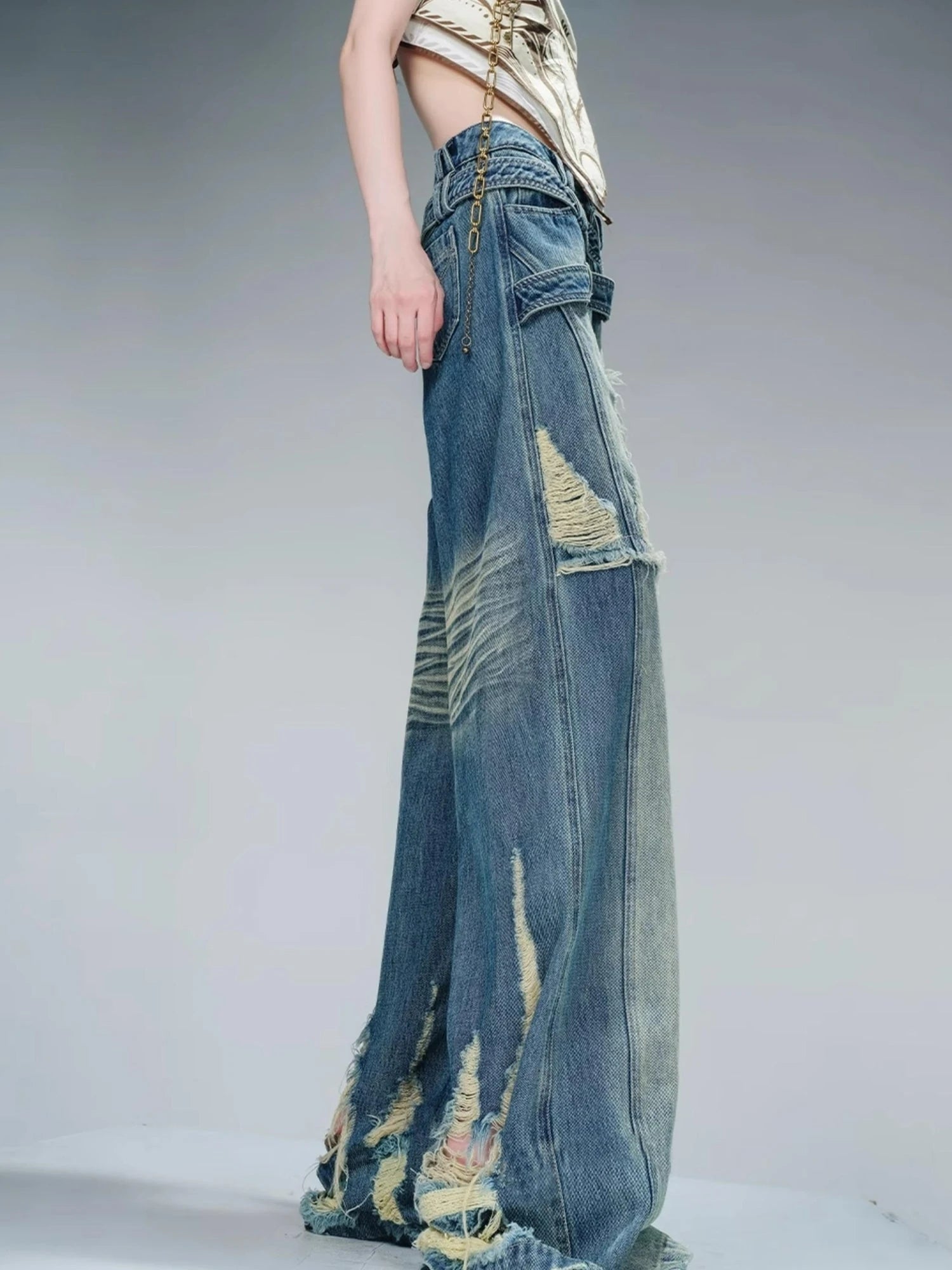 Distressed Pulled Denim Jeans With Ripped Details