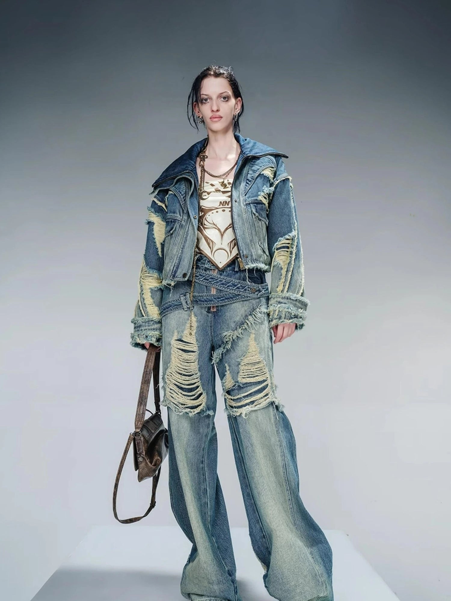 Distressed Pulled Denim Jeans With Ripped Details