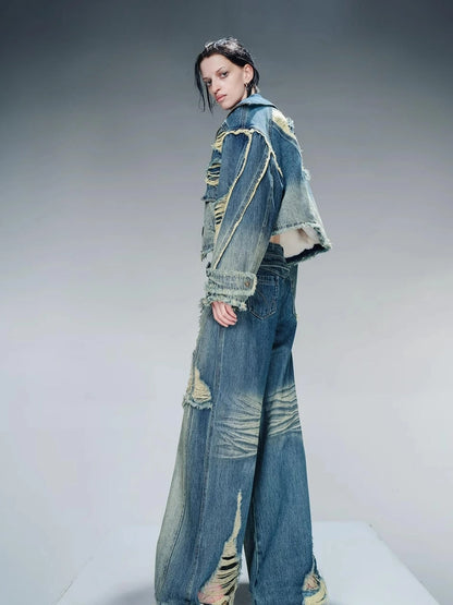 Distressed Pulled Denim Jeans With Ripped Details