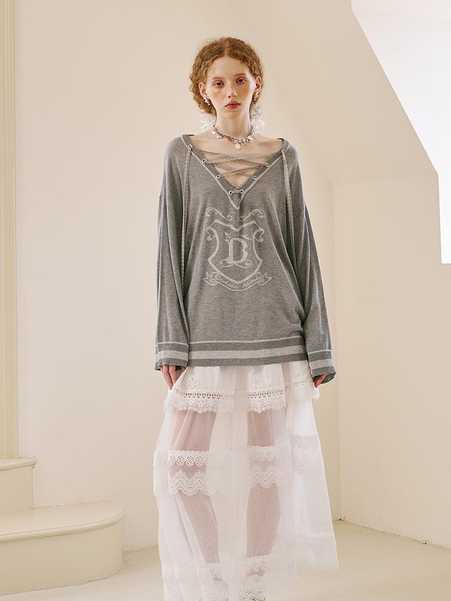DIDDI MODA Vintage Lace Up V Neck Knit Top With Embroidered Crest