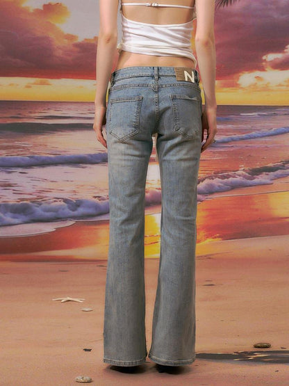 The NeverMore Durable Distressed Relaxed Low Rise Light Blue Denim Women Straight Leg Jeans