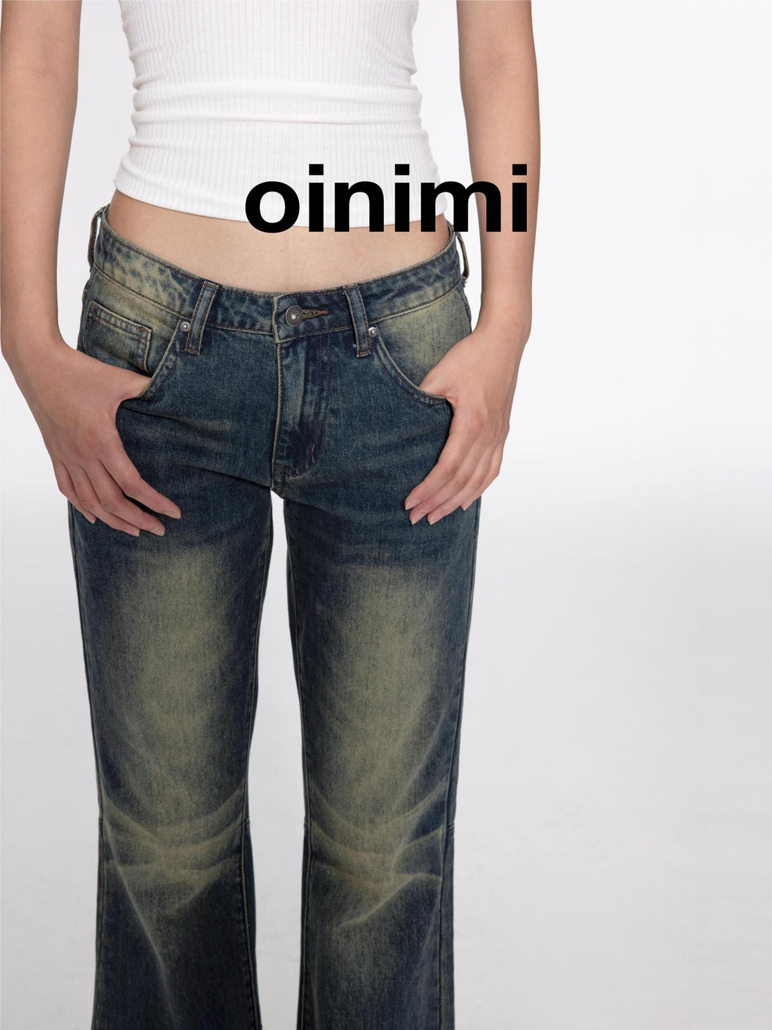 oinimi Low Rise Flared Jeans With Stacked Hem
